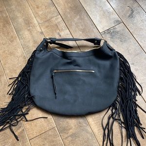Women’s Faux black leather fringed handbag